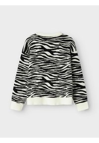 Maglione a righe zebrate bianco e nero con scollatura rotonda, polsini e orlo a coste, realizzato in un morbido materiale lavorato a maglia.