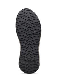 Suela de zapato con una superficie de goma negra, que presenta un patrón de banda de rodadura en zigzag y un borde beige con el logotipo en relieve "VOILE BLANCHE".