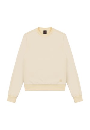 Crème kleurige sweatshirt gemaakt van zacht materiaal. Heeft een ronde hals, ribgebreide boorden en onderkant, met een klein logo rechtsonder.