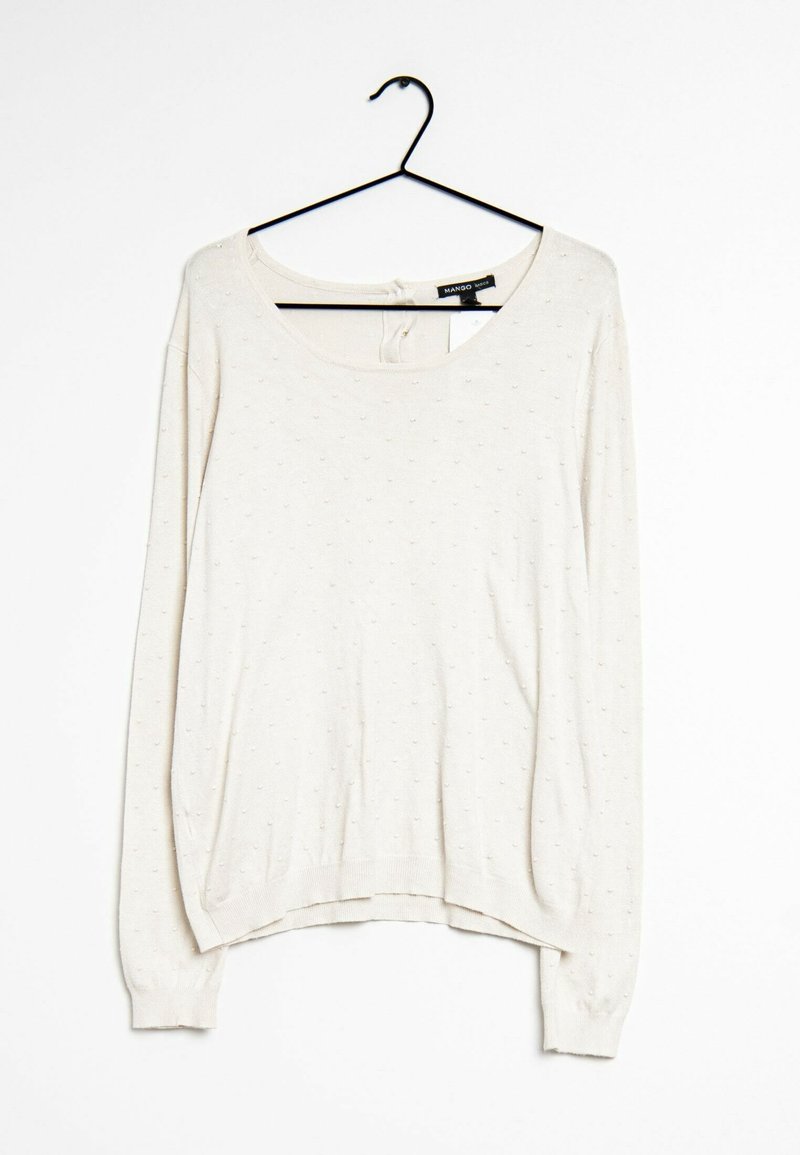 Pull léger blanc à manches longues avec motif à pois texturé, encolure ronde et poignets côtelés, suspendu à un cintre noir.