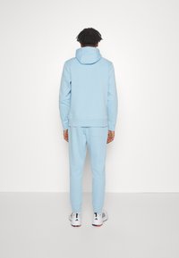 Calvin Klein Golf PLANET SPORTS SUIT - Trenirka - air blue