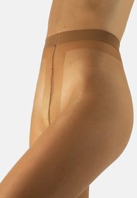 Medias tupidas en tono nude con textura suave, que cuentan con una cintura ancha y un acabado sin costuras en la parte delantera y trasera para un ajuste discreto.