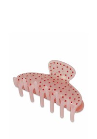 Clip para el pelo rosa con un acabado suave y brillante, adornado con lunares rojos y dorados, forma curva y ocho puntas entrelazadas.