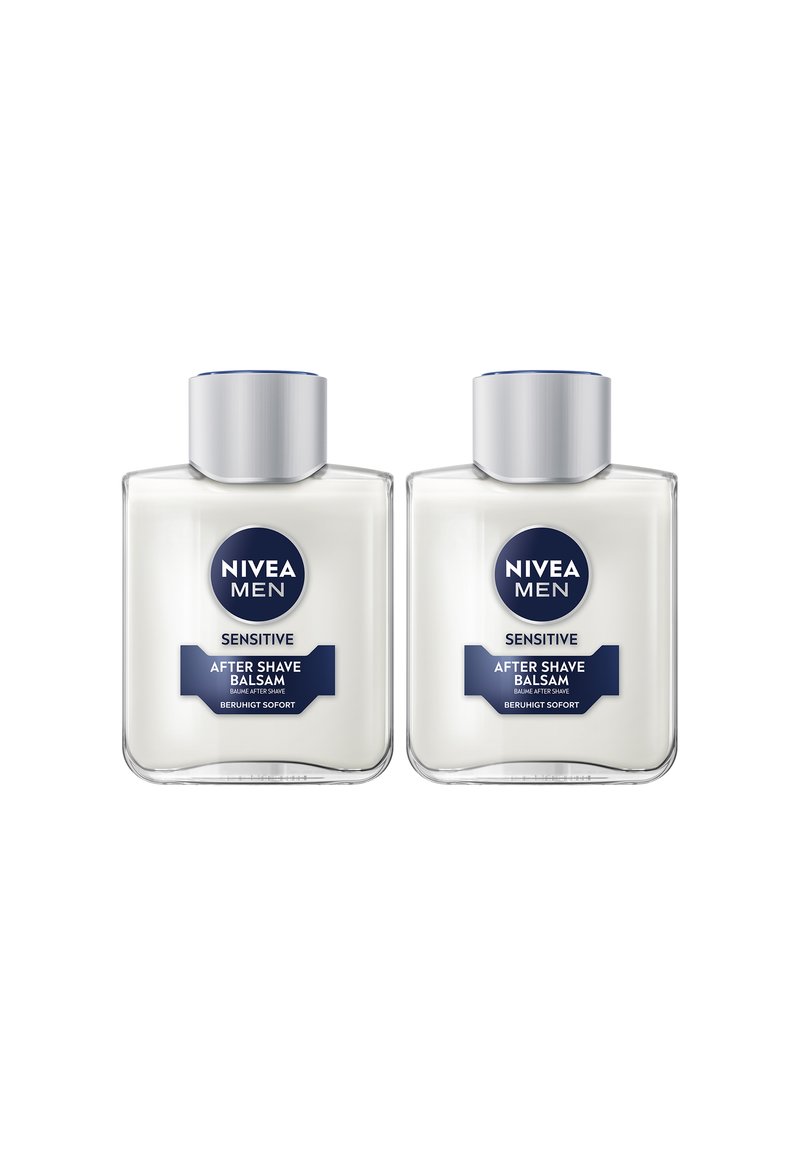 Two clear plastic bottles of NIVEA Men Sensitive After Shave Balsam. Each has a silver cap and a white cream texture. Labels are blue and white.