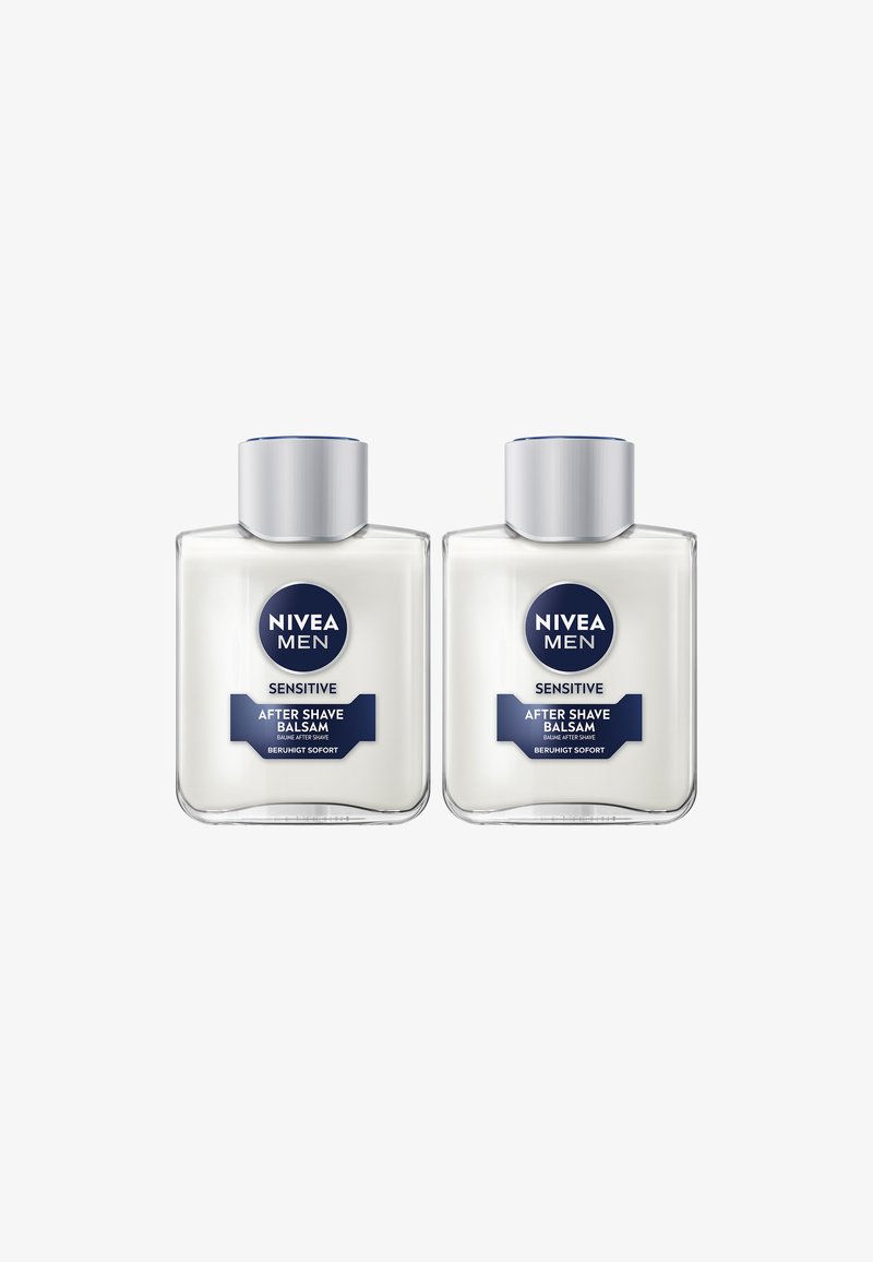 Two clear plastic bottles of NIVEA Men Sensitive After Shave Balsam. Each has a silver cap and a white cream texture. Labels are blue and white.