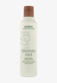 Aveda Rosemary Mint kroppslotionflaska, vit förpackning med ett brunt lock, har gröna löv grafik och text på engelska och franska.