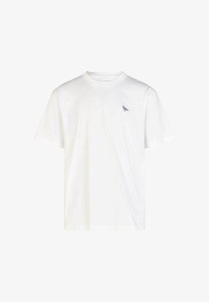 Weißes Baumwoll-T-Shirt mit Rundhalsausschnitt und kurzen Ärmeln. Mit einem kleinen grauen Vogel-Graphic auf der linken Brust. Weiche Textur, lässige Passform.