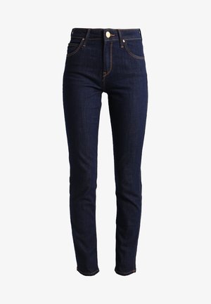 Mørkeblå denimjeans med slim fit, høj talje og synlige syninger. Har en knap- og lynlåslukning samt sidelommer.