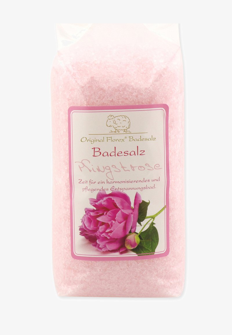 Pink bath salt in a clear plastic packaging, featuring a label with a pink peony illustration and gold accents, on a white background.