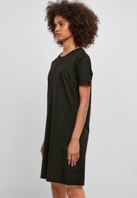 Black, short-sleeve, knee-length dress in a relaxed fit, made of soft cotton fabric with a smooth texture and a simple round neckline.
