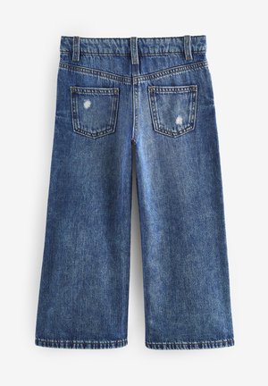 Denim culottes met een medium blauwe wassing, met een losse pasvorm, rafelige zoom en twee achterzakken met subtiele slijtage.
