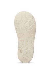 Sålen på en ljusbeige sko med cirkulära präglade mönster, ordet "Naturino" och siffran 20 nära hälen.