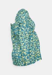 Vestido floral em tecido turquesa com flores amarelas. Apresenta mangas bufantes, decote elástico e um caimento solto para maior conforto.