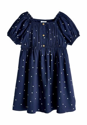 Marineblaues Kurzarmkleid mit weißen Polka-Dots, elastischen Schultern und Ärmeln, Knopfleiste vorne und geraffter Taille.