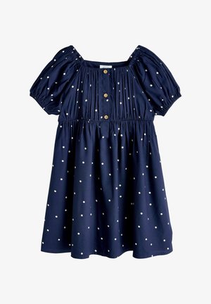 Granatowa sukienka z krótkim rękawem w białe kropki, z elastycznymi ramionami i rękawami, zapinana na guziki z przodu, z marszczonym pasem.