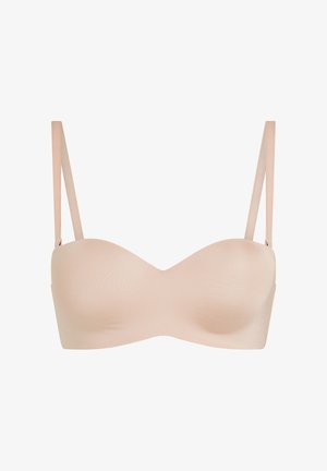 Naadloze nude strapless beha met afneembare dunne schouderbandjes, glad gevormde cups, ontworpen voor ondersteuning en veelzijdigheid.