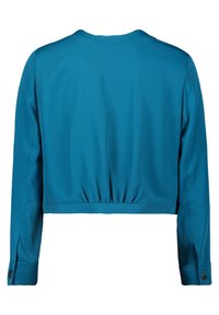 Cropped teal jacket with long sleeves, gathered detail at the back, and button accents on the cuffs. Smooth fabric texture.