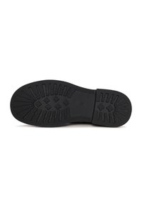 Suela de zapato de goma negra con surcos profundos que presentan patrones rectangulares y en forma de cruz, talla 39 marcada en el centro.