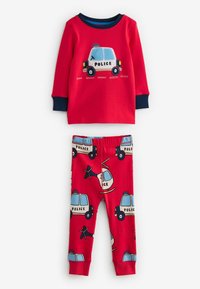 Ensemble de pyjama rouge comprenant un haut à manches longues avec un graphique de voiture de police et un pantalon à motifs représentant des véhicules de police et des hélicoptères.