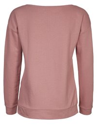 Maglietta a maniche lunghe, dal taglio ampio, in un morbido tessuto rosa chiaro. Presenta un ampio scollo e un orlo a coste, con una texture liscia e un design minimalista.