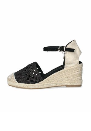 Zapato de esparto trenzado negro con correa al tobillo, tejido texturizado, parte trasera a cuadros beige y suela de cuña de yute.