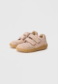 Pink shoes with glittery accents, two Velcro straps, and a gum sole. Soft material with rounded shape and textured surface.