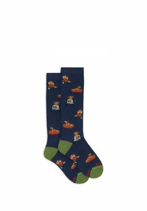 Calzini blu navy con illustrazioni di cani marroni in varie pose, con accenti verdi sui polsini. Materiale in misto cotone, motivo giocoso.
