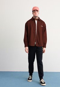 Nike Sportswear JOGGER   - Treniņtērpa apakšdaļas - black