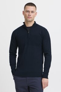 Jersey de punto azul marino con cuello de media cremallera, mangas largas, puños y dobladillo acanalados, que presenta un panel horizontal texturizado en el pecho.