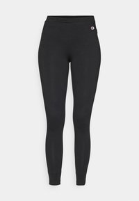 Svarte tights med elastisk midje, med en liten Champion-logo øverst til venstre på hoften.