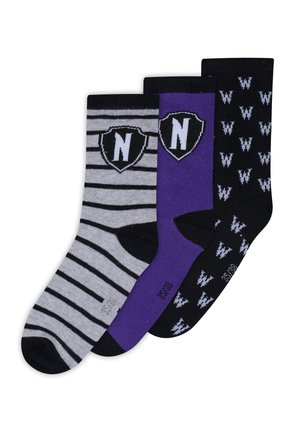 Three pairs of crew-length socks: one gray with black stripes and a black shield logo, one solid purple, and one black with white patterns.