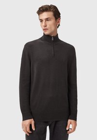 Ciemnoszary sweter typu half-zip wykonany z miękkiego dzianiny. Posiada wysoki kołnierz, długie rękawy oraz dopasowany dół. Minimalistyczny design, bez wzorów.