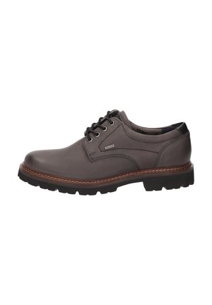 Scarpa da uomo in pelle marrone con lacci, suola in gomma nera e cuciture a contrasto lungo il bordo della suola.