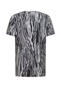 Black and white short-sleeve t-shirt featuring an abstract wavy pattern, made from soft fabric with a relaxed fit and crew neckline.