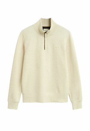 Pullover beige a maniche lunghe con colletto a metà zip e polsini a costine, con un logo goffrato discreto sul petto.