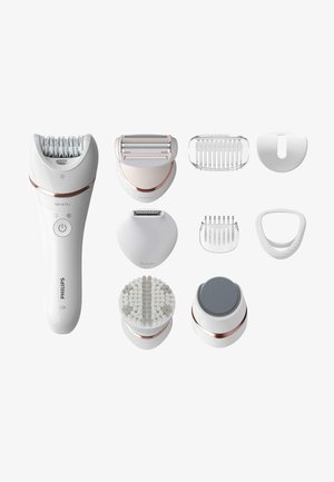 De Philips epilator set bevat een witte handgreep met roségouden accenten, meerdere verwisselbare koppen en verschillende texturen voor ontharing en huidverzorging.