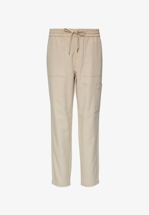 Beige Jogginghosen aus weichem Stoff, mit einem elastischen Bund und Kordelzug, zwei Fronttaschen und einer seitlichen Cargo-Tasche.
