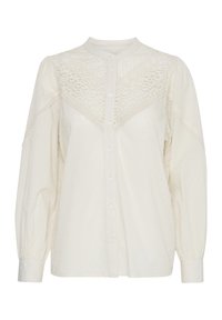 Camicia bianca con bottoni frontali, tessuto testurizzato, dettagli in pizzo sulle spalle e maniche lunghe a sbuffo. Presenta un colletto alla mandarino e motivi sottili.