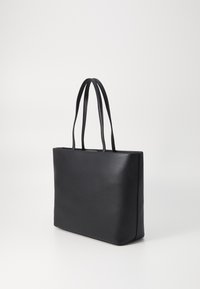 Black leather tote bag with smooth texture, rectangular shape, and two long handles. Minimalist design with no visible hardware or accents.