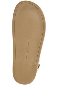 Suola di sandalo in gomma tan con texture rigata e punti di presa circolari. Presenta il marchio "dolce vita" in rilievo e un bordo arrotondato e liscio.