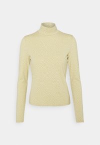 Langärmliges Turtleneck-Shirt in Hellgelb mit weißen Punkten. Hergestellt aus dehnbarem Stoff, mit tailliertem Schnitt.