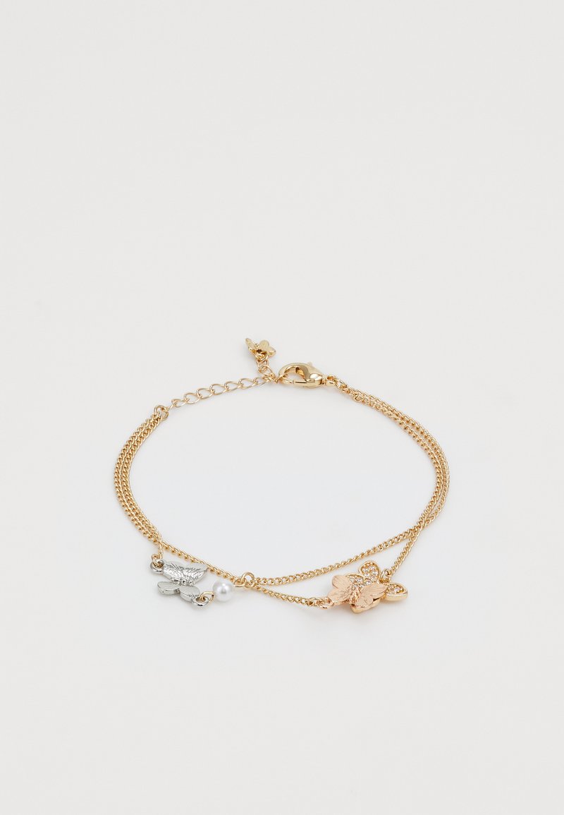 Gold and silver bracelet featuring layered chains, a small pearl, and butterfly charms with textured details and a lobster clasp.