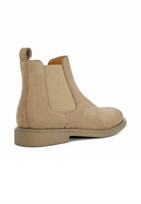Beige suede Chelsea boot with elastic side panels and a subtle heel. Features a back pull tab and a solid tan rubber outsole.