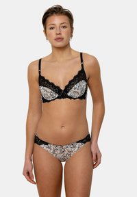 Soutien-gorge noir avec bord en dentelle et culottes assorties avec un motif floral en beige et noir. Bretelles ajustables et texture de tissu douce.