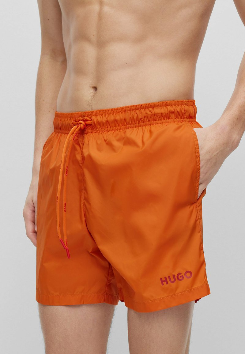 HUGO HAITI SLIM FIT Swimming shorts orange mottled orange mottled