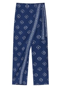 Navy siniset wrap-housut, joissa on valkoinen geometrinen painatus. Valmistettu pehmeästä kankaasta, jossa on sivusolmu ja koristeellinen nauha reunan ympärillä.