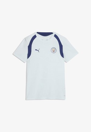 Maillot de football blanc de Manchester City avec des bandes bleu marine sur les épaules et le logo Puma à l'avant.