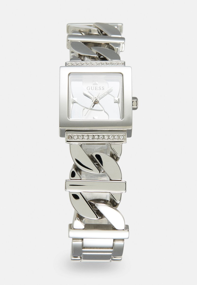 Montre en argent avec un cadran carré, mouvement à quartz, et un bracelet en chaîne décoratif accentué de strass transparents.