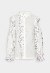 Blouse blanche avec des bords volants, broderie florale violette et rose, manches longues avec des poignets froncés et un col haut.
