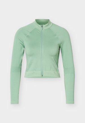 Hele-roheline lühike piksevarrukaga jakk, esiküljel tõmblukuga ja püstkraega, esitatud tavalise valge taustaga.